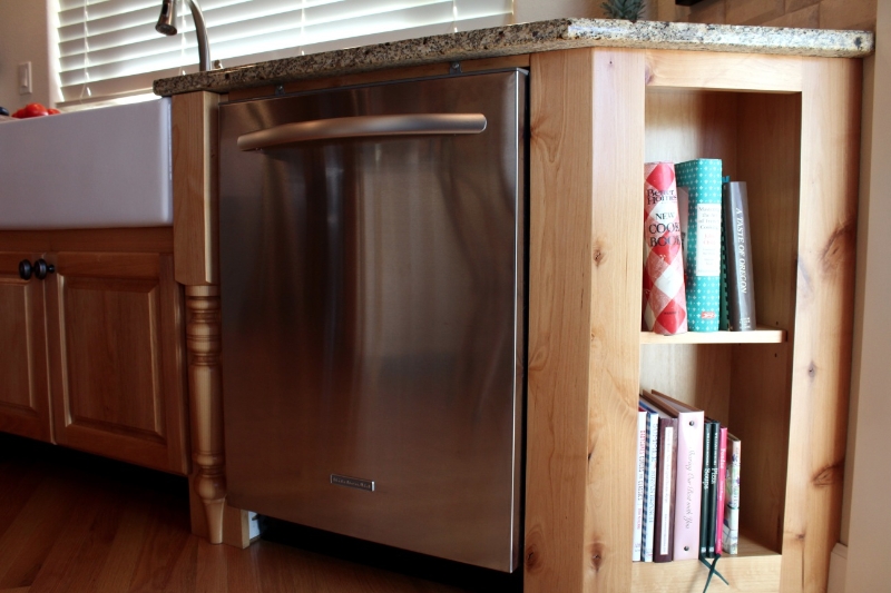 Bookshelves built into end of kitchen cabinets
