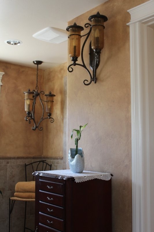 Bathroom tiles and wall sconces