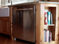 Bookshelves built into end of kitchen cabinets