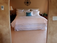 Arched entryway into master bedroom